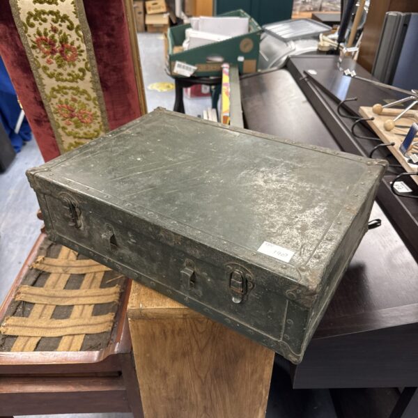 Vintage wooden storage box with embossed pattern.