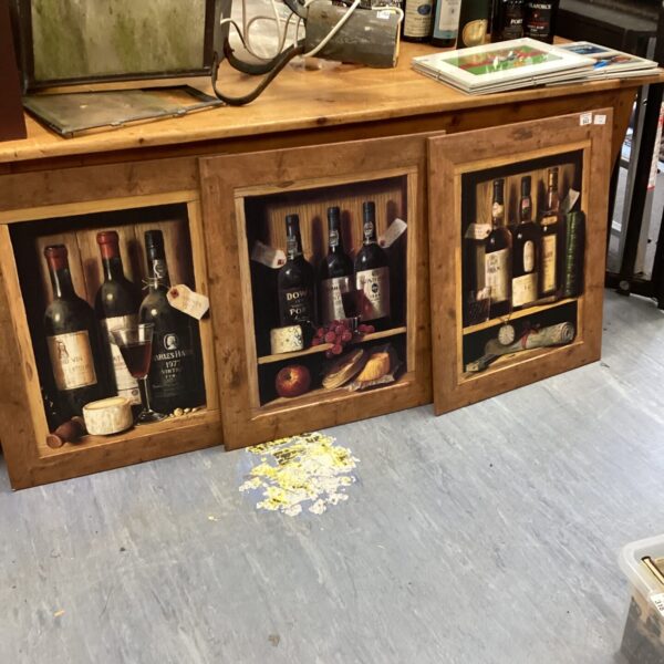 Set of three framed vintage port bottle prints for wall decor.