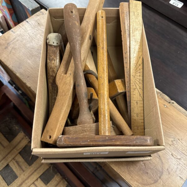 Vintage woodworking tools lot including hand planes and shaping tools.