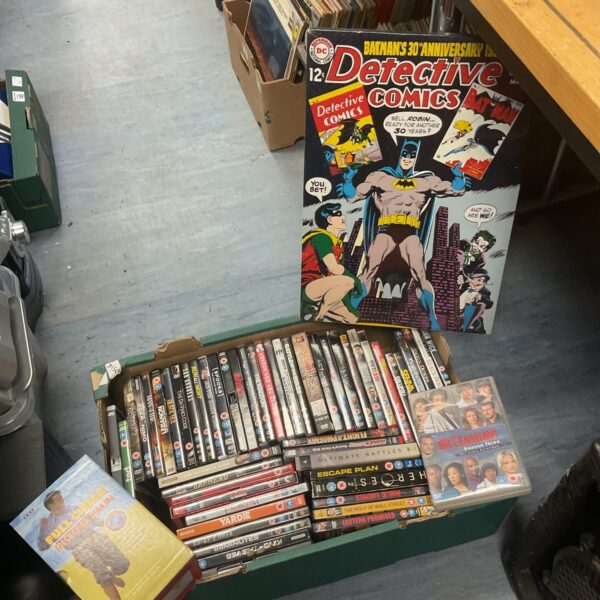 A lot of Batman DVDs and a canvas print for collectors.