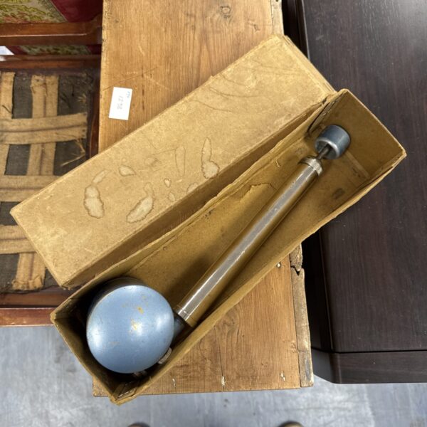 Vintage Flit sprayer with bulb reservoir and nozzle.