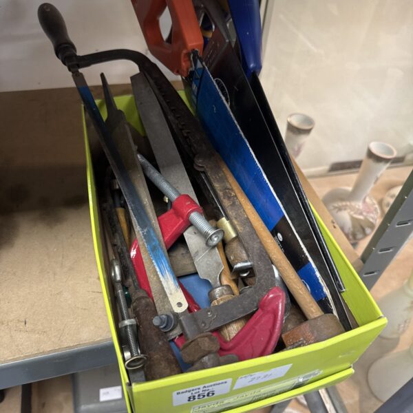 Vintage tool lot featuring G clamps and hand saws for DIY projects.