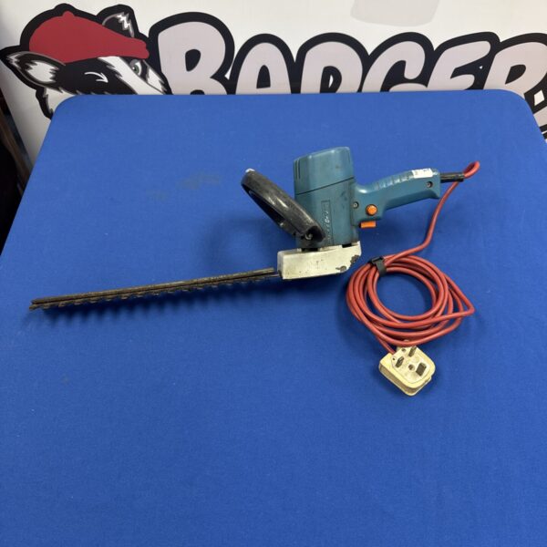 Black & Decker electric hedge cutter for garden trimming and maintenance.