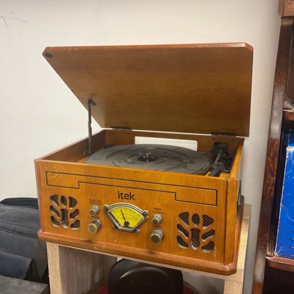 Vintage Itek retro radio turntable system with woodgrain finish.