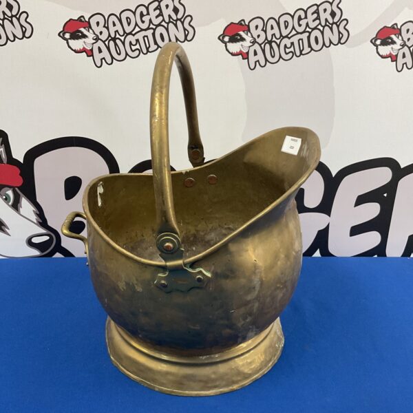 Vintage brass helmet coal scuttle for fireplace use.