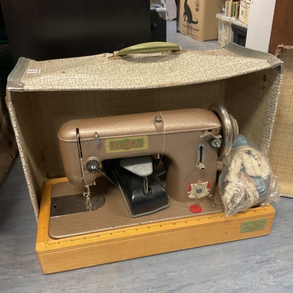 Vintage So Rite sewing machine with case, retro collectible.