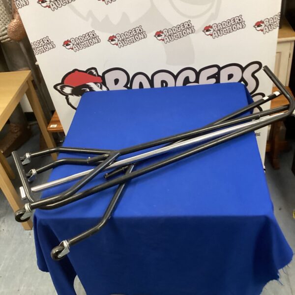 Silver metal clothes rail for garment display.