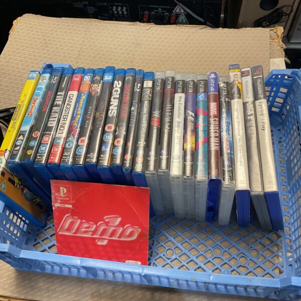 Tray of Sony PlayStation 3 games and Blu-ray movies for sale.