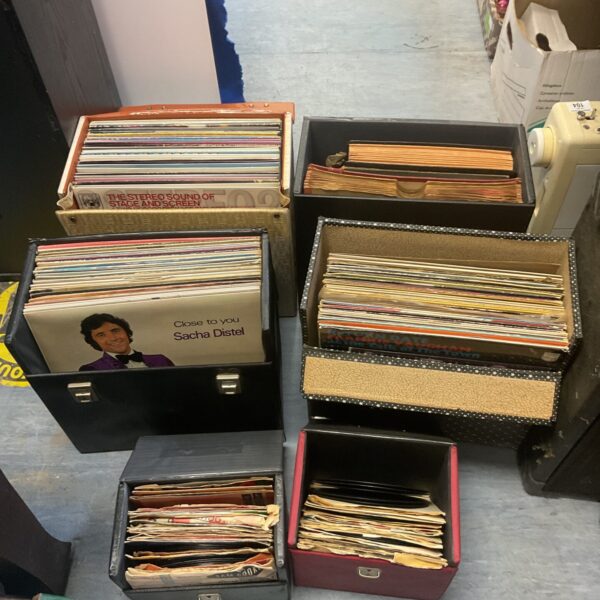 Six cases filled with a diverse vinyl record collection for music lovers.