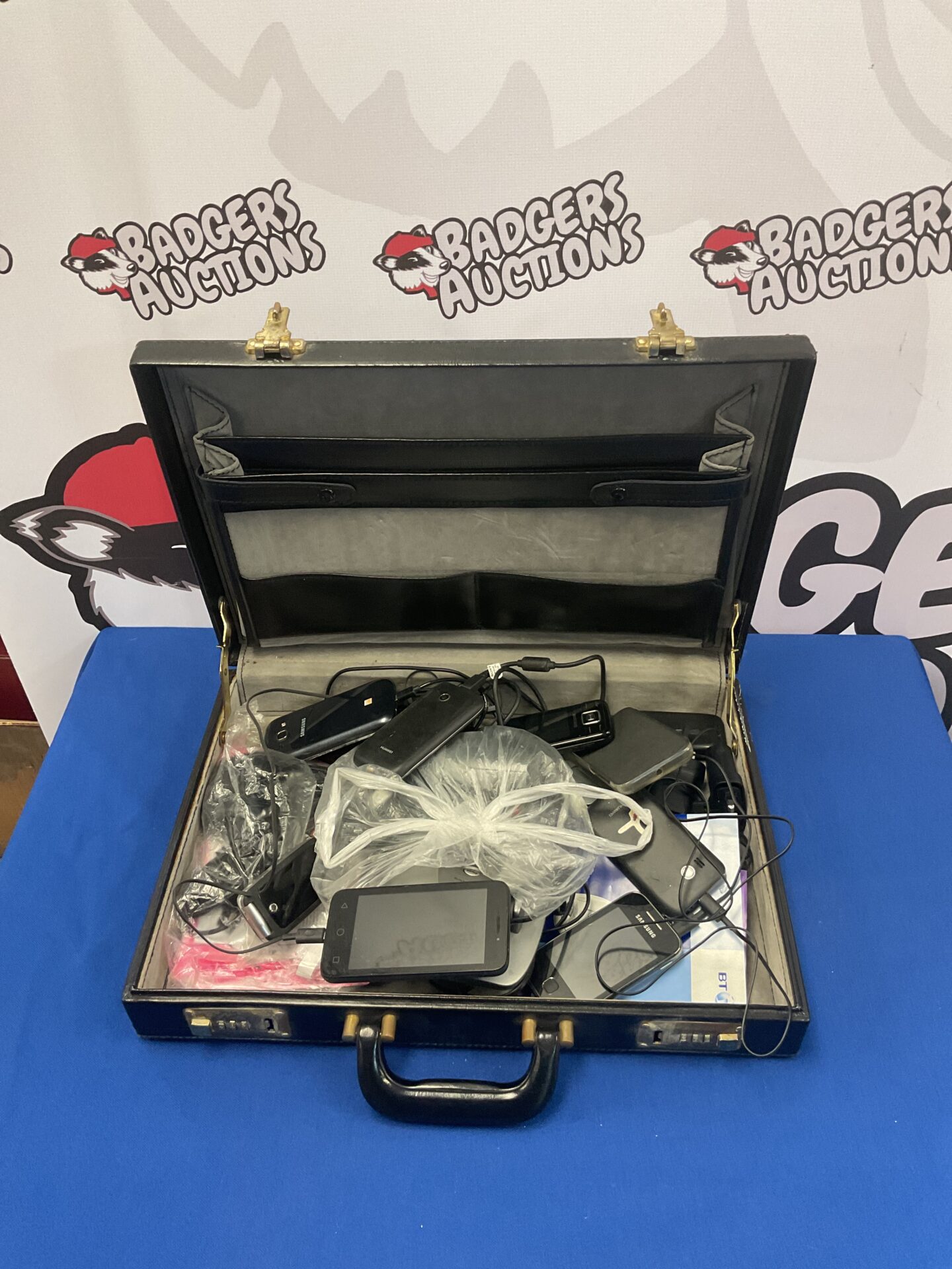 154 Briefcase of phones including samsung