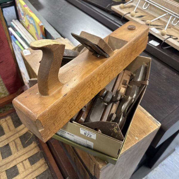 Vintage wood planes in a box, antique woodworking tools.