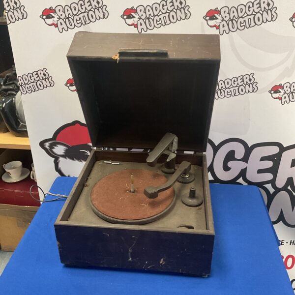 Side view of a vintage gramophone for restoration.