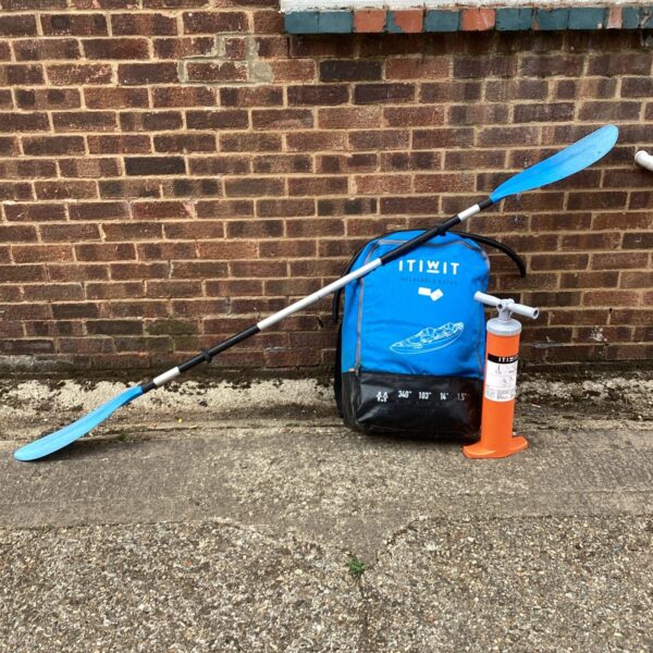 Itiwit inflatable kayak with paddle and pump setup.