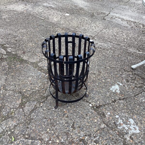 Vintage metal garden incinerator for burning waste outdoors.