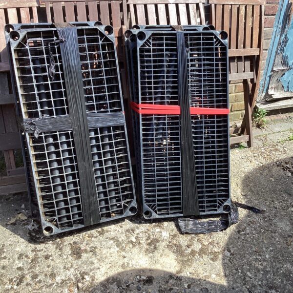 Two sets of plastic shelving for garage or utility room storage.