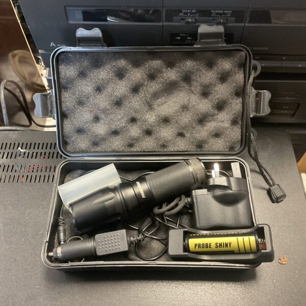 Black Probe LED torch inside a protective hard case.