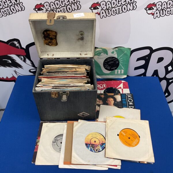 Collection of 7” single vinyl records in case