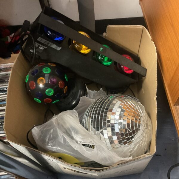 A box of vintage disco lights and a glitter ball.