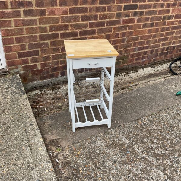 White kitchen side unit with racking and a single drawer.