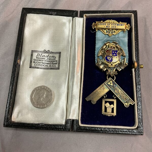 Open case displaying antique Masonic Past Masters Jewel.
