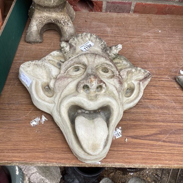 Detailed stone effect Green Man wall ornament for garden or home decor.