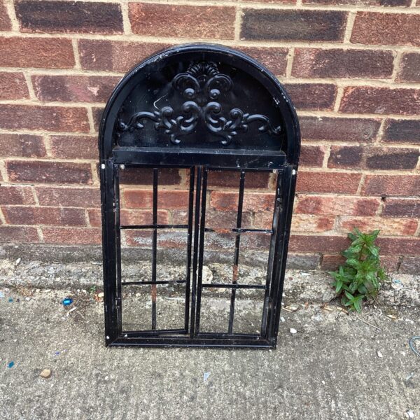 Ornate metal garden wall arch for outdoor decoration.