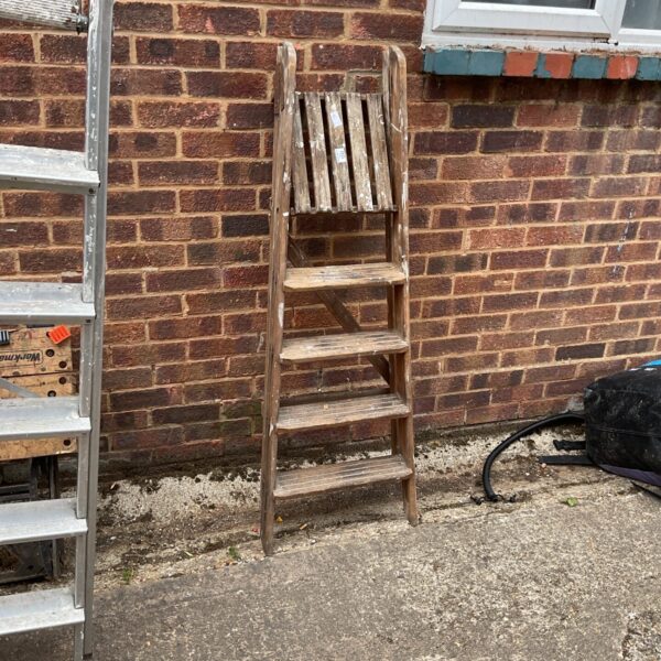 Vintage wooden step ladder, weathered and showing signs of age.