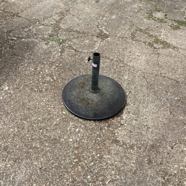 Heavy-duty metal parasol base for garden or patio use.
