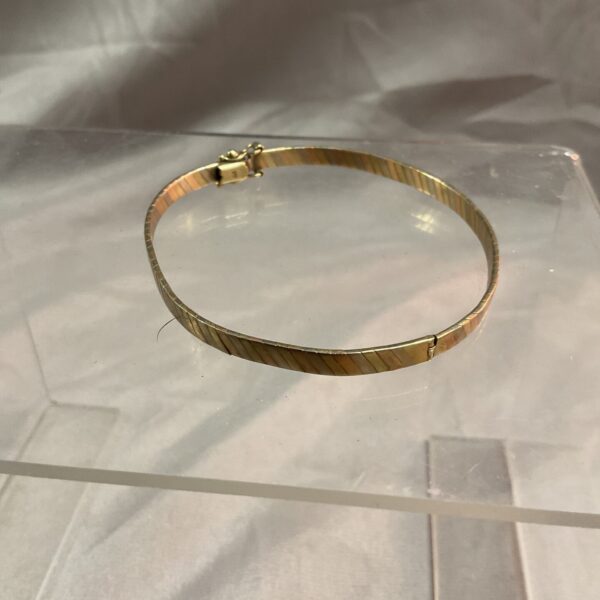 Vintage 9ct gold hinged bracelet with three colour gold bands.