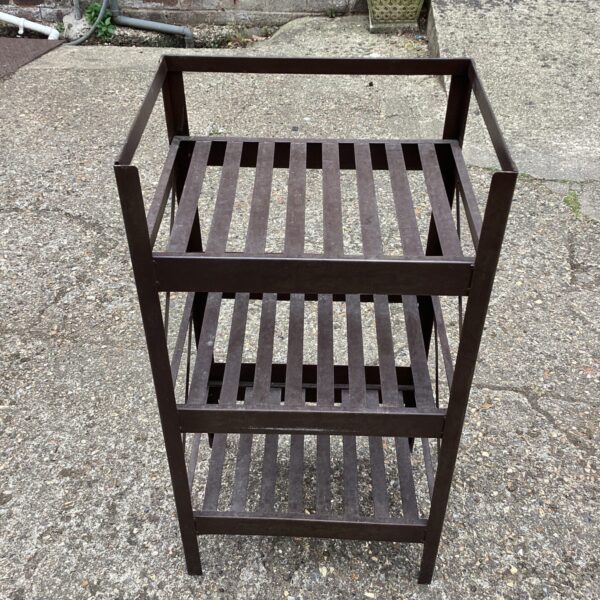 Three-tier metal storage racking unit for industrial use.