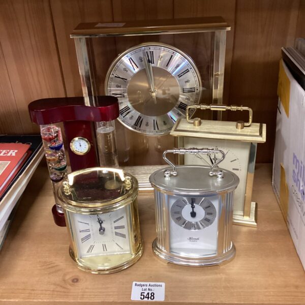 Antique carriage clocks and barometer in a collection lot.