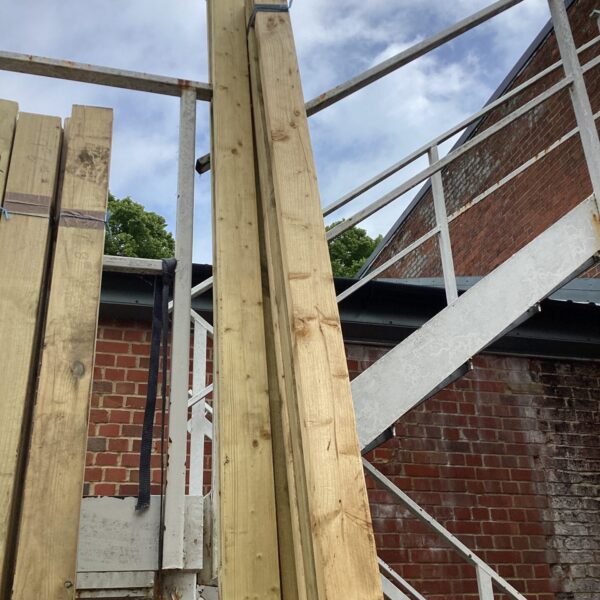 Stacked timber bundles for construction and DIY projects.