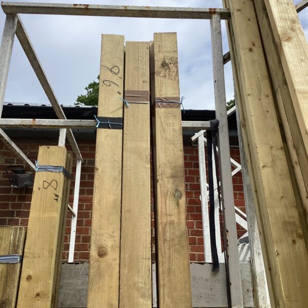 Untreated timber bundles measuring 9’6” for construction projects.