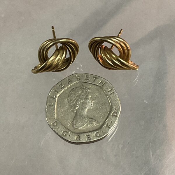 Delicate 9ct gold hoop earrings with twisted wire design.