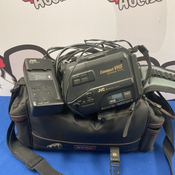 Vintage JVC GR-AX5 camcorder with cables, side view.