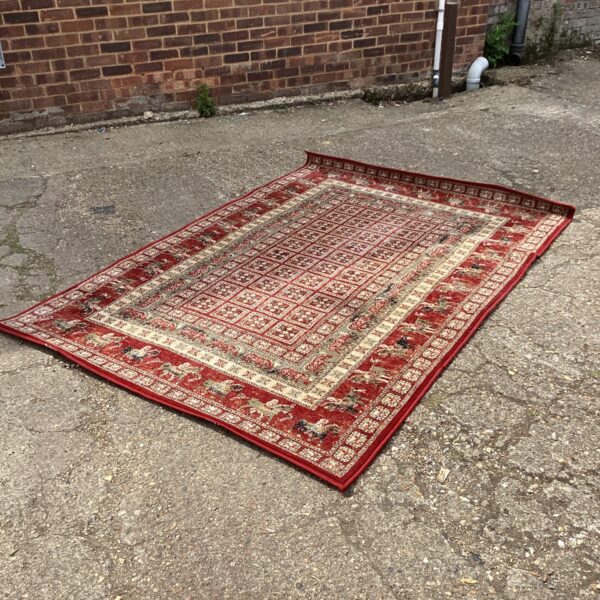 Red Persian rug with traditional design, 160 x 235cm.