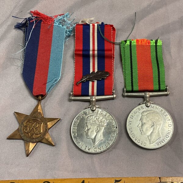 WWII medal group including 1939-45 Star, War Medal, and Defence Medal.