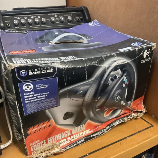Logitech GameCube racing wheel with force feedback technology.