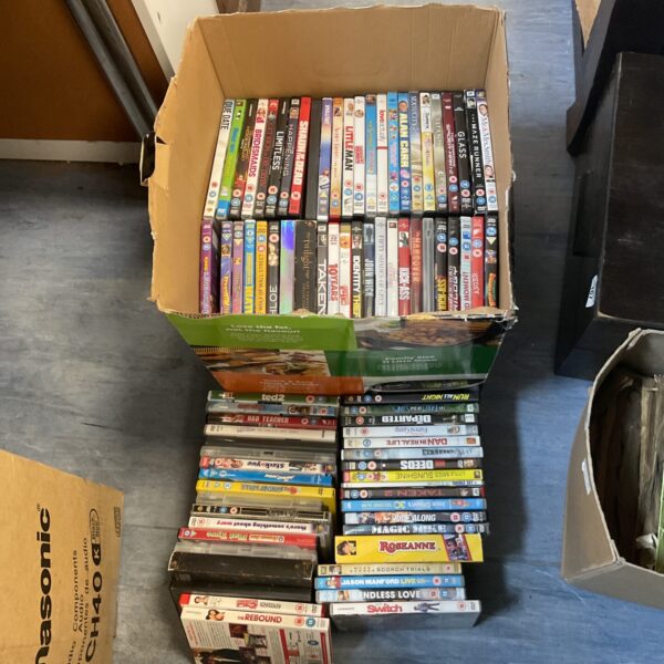 Large lot of DVDs including Rosanne boxset for home entertainment.