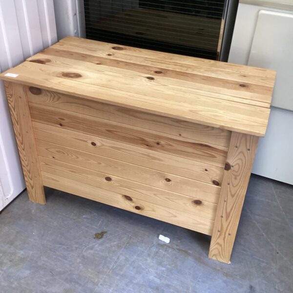 Rustic pine chest for storage, handmade wooden design.