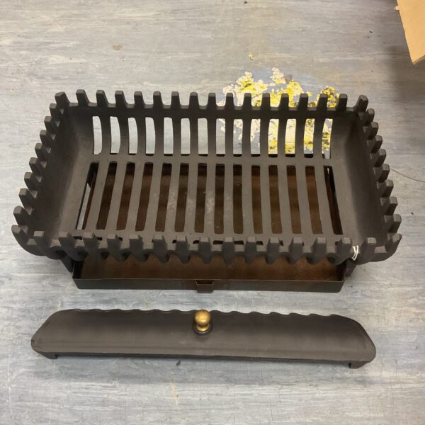 Antique cast iron fireplace grate, 21 x 12 inches, for hearth use.