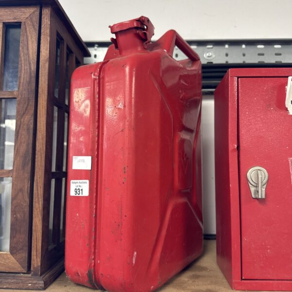 Vintage red jerry can, a classic metal fuel container.