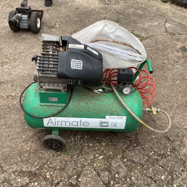 Used Sip Airmate air compressor with attached air hose.