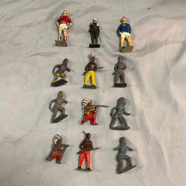 Vintage lead Indian figures including warriors and football players.
