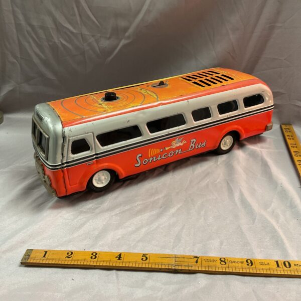 Vintage Sonicon bus toy with ruler for scale.