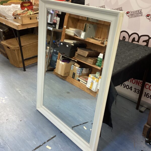 Large bevel edge mirror with white frame, ideal for home decor.