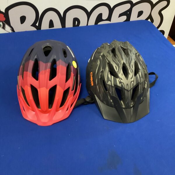 Red and black cycling helmets, Rockrider model included.