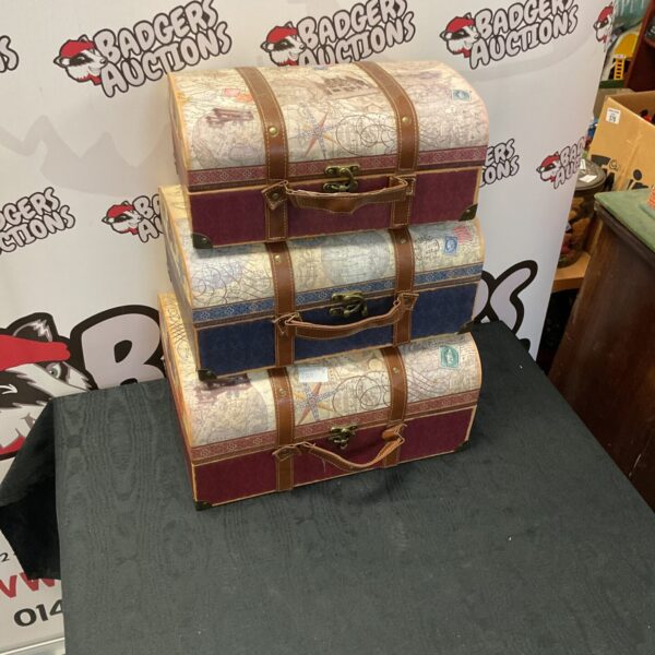 Set of three vintage storage crates with map designs.