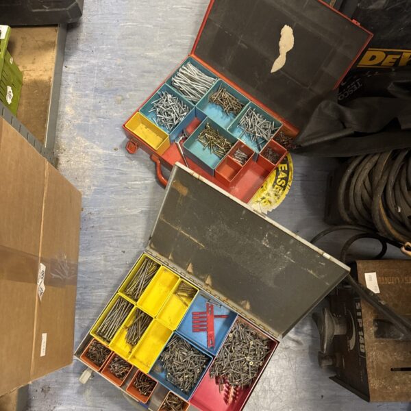 Open trade case filled with assorted screws for DIY projects.