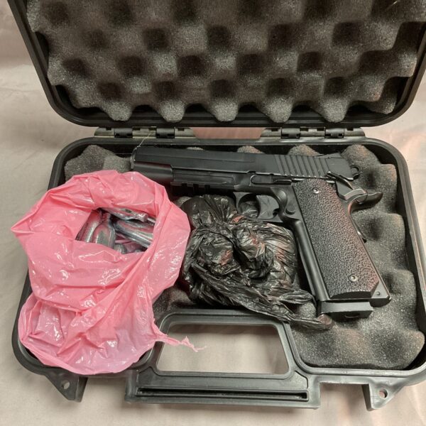 Black CO2 air pistol in a hard case with cartridge and BBs.